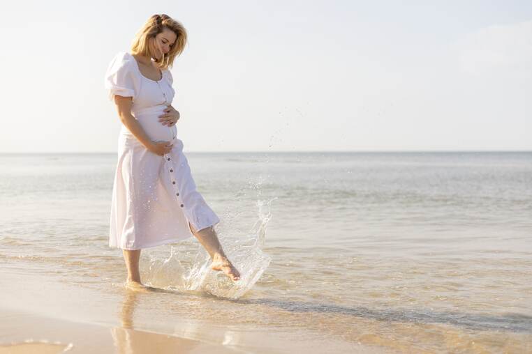 happy-pregnant-woman-spending-time-on-a-beach-2022-04-01-04-43-12-utc-min (1)