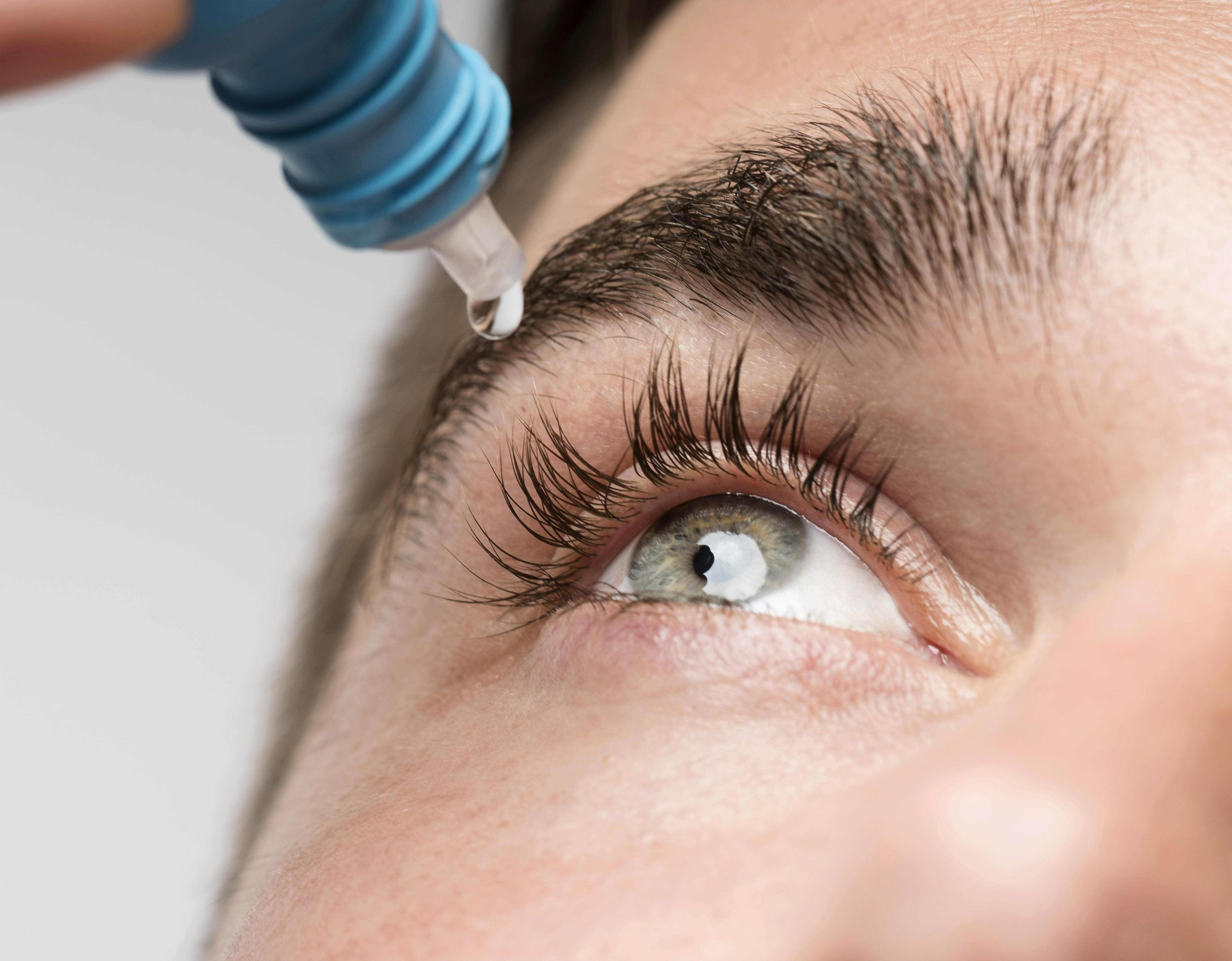 handsome-man-using-eye-drops-close-up-min-compressed