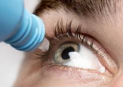 man-using-eye-drops-close-up (1)