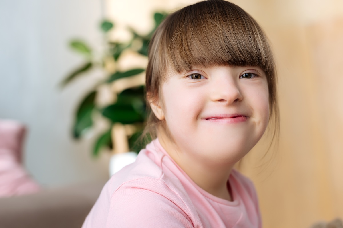 portrait-of-smiling-kid-with-down-syndrome-2026-03-13-01-20-06-utc
